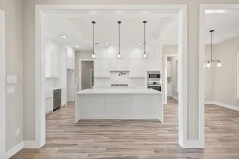 View into the kitchen through an arched opening